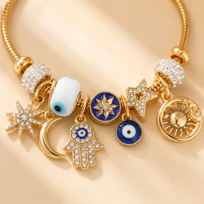 Celestial Charm Bracelet – Gold-Tone Evil Eye, Sun, Moon & Star Layered Charm Bracelet