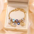 Bracciale con ciondoli celesti – Bracciale a strati con ciondoli Occhio di Allah, Sole, Luna e Stella color oro